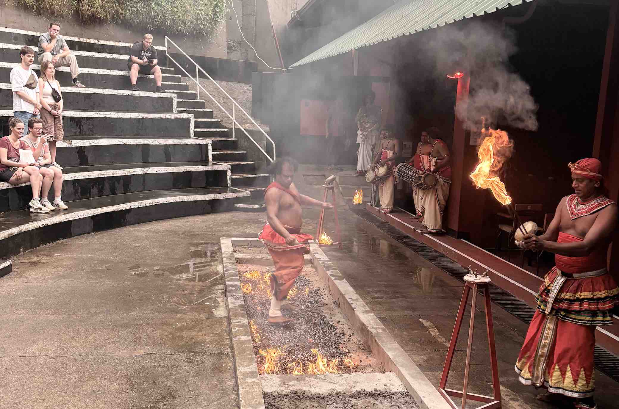Performer walking across red-hot embers at the Kandy Cultural Show fire walking ceremony