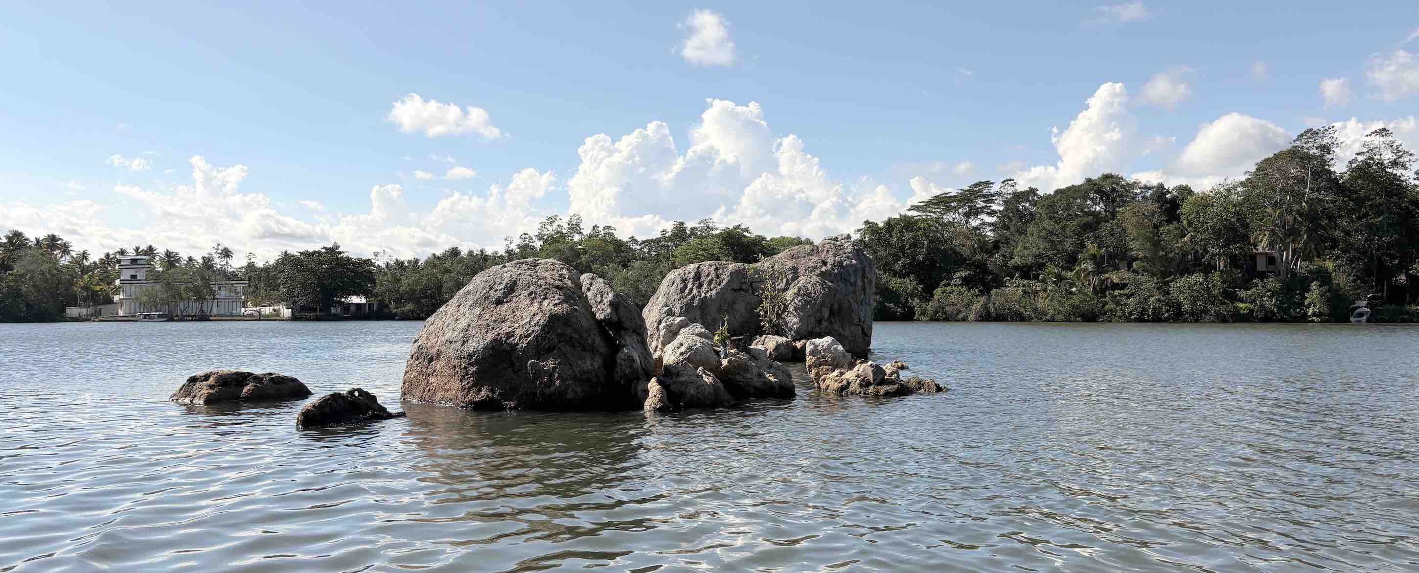Koggala Lake boat safari through calm lagoon water in Sri Lanka